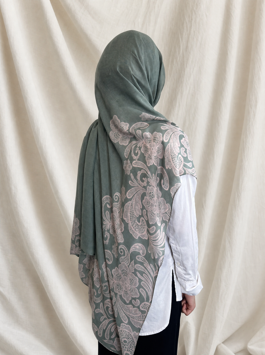 Jade Lace printed hijab by The Noorea Collection, back view, white drapery backdrop